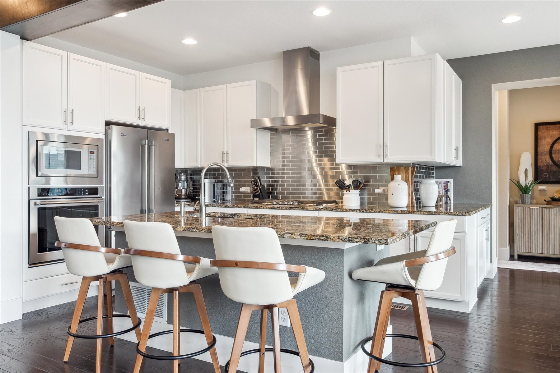 Renovated white kitchen with island — fix & flip example